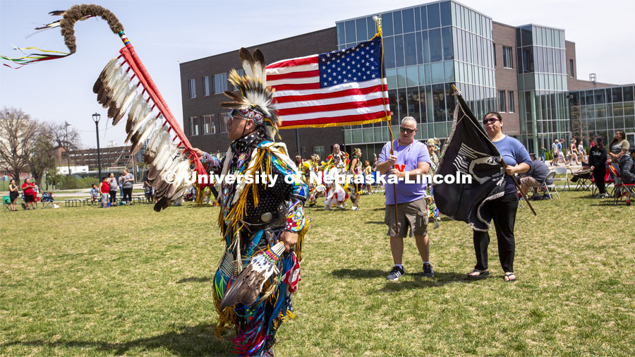 Scott Aldrich, head man dancer (left) leads the colors into the circle at the start of the UNITE powwow on April 23. 2022 UNITE powwow to honor graduates (K through college). Held April 23 on the greenspace along 17th Street, immediately west of the Willa Cather Dining Center. This was UNITE’s first powwow in three years. The MC was Craig Cleveland Jr. Arena director was Mike Wolfe Sr. Host Northern Drum was Standing Horse. Host Southern Drum was Omaha White Tail. Head Woman Dancer was Kaira Wolfe. Head Man Dancer was Scott Aldrich. Special contest was a Potato Dance. April 23, 2023. Photo by Troy Fedderson / University Communication.